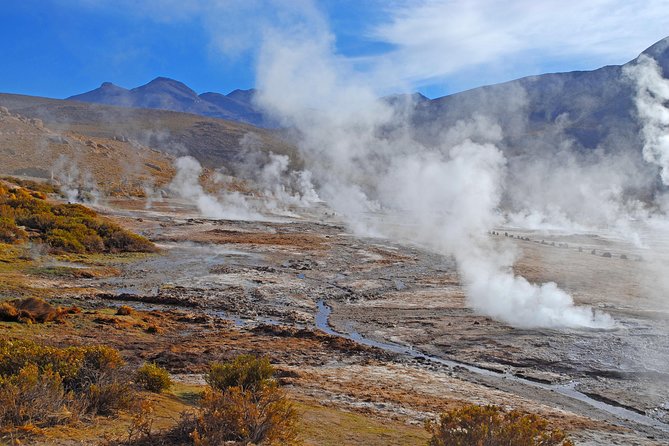 El Tatio Geysers Tour from San Pedro de Atacama - Walking through the Geyser del Tatio field at sunrise