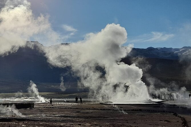 Full Day Tour to Geyser del Tatio, Vado Putana and Machuca - Standing among the El Tatio fumaroles