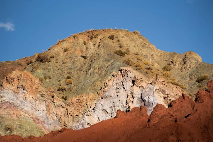 San Pedro de Atacama: Rainbow Valley & Hierbas Buenas Tour - Walking into the red, green, and white valley
